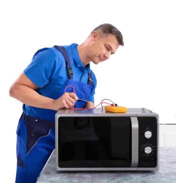 A British man dressed in blue and inspecting the microwave oven with a multimeter