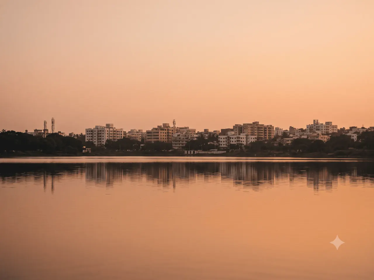 Unkal Lake at dawn with the Hubli-Dharwad skyline reflected on the water